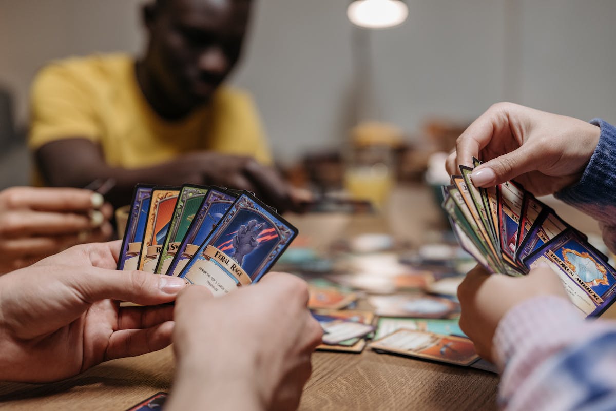 Trading card singles laid out on a shop counter
